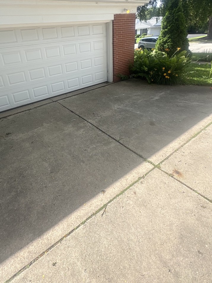 The same driveway swept clean after TT's Junk Removal hauled everything away